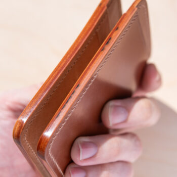 Burnished shell cordovan edges on a handmade wallet.