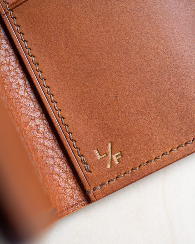 Close up of logo on folding card wallet.