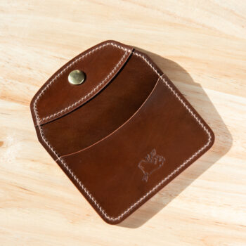 Exterior of a shell cordovan snap wallet.