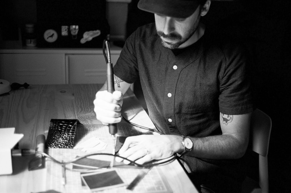 Me crafting leather goods in the workshop