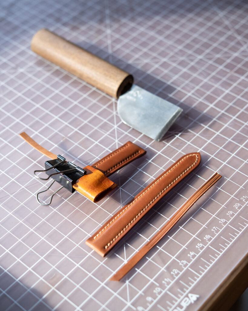 Leather craft tools and project in process.