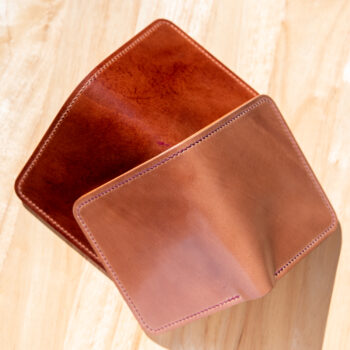Two leather wallets in a range of autumn colors