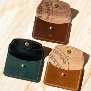 Three shell cordovan wallets in a range of colors